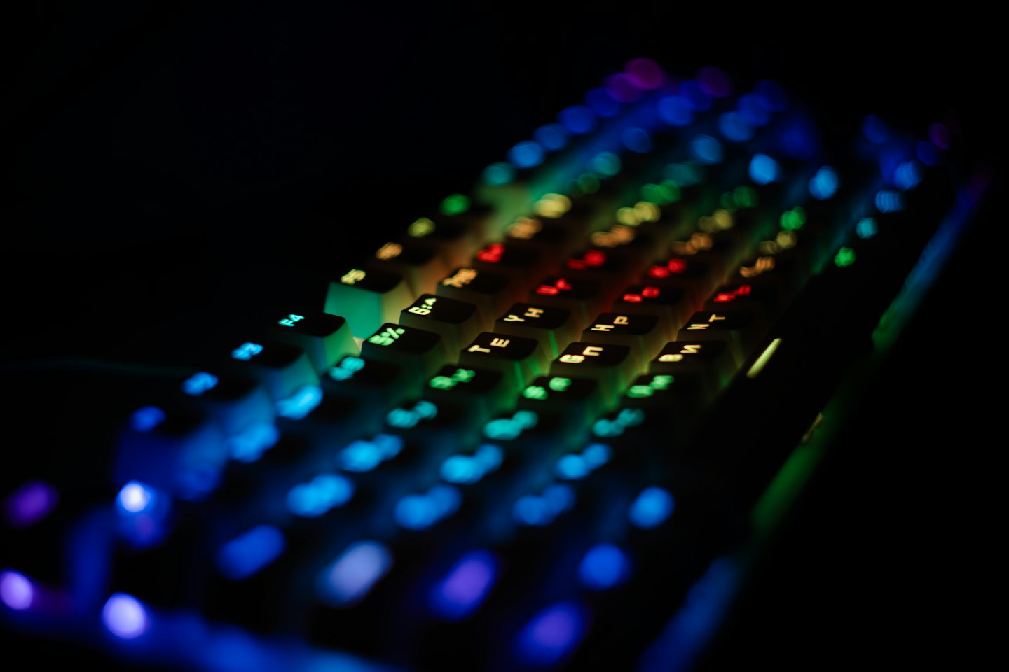 Mechanical keyboard with illuminated Latin and Cyrillic characters.